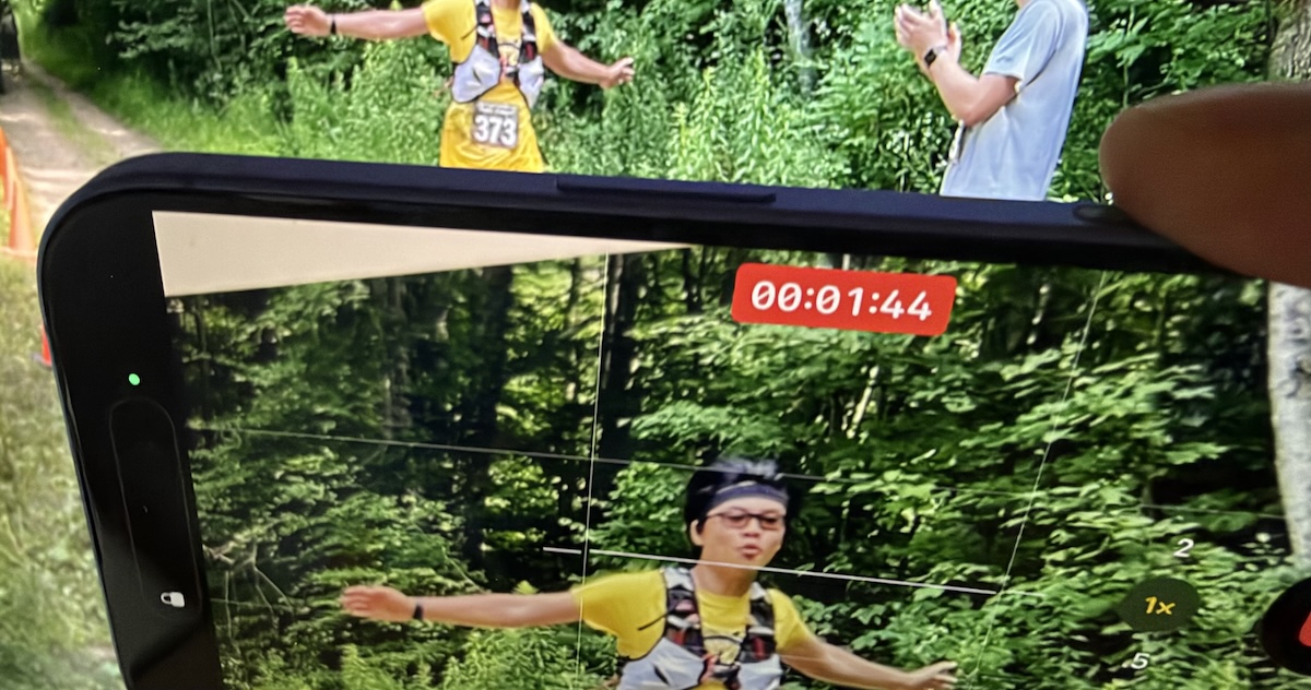 iPhone held horizontally while shooting a video to illustrate Take Quick Videos with the Camera Control | AustinMacWorks.com