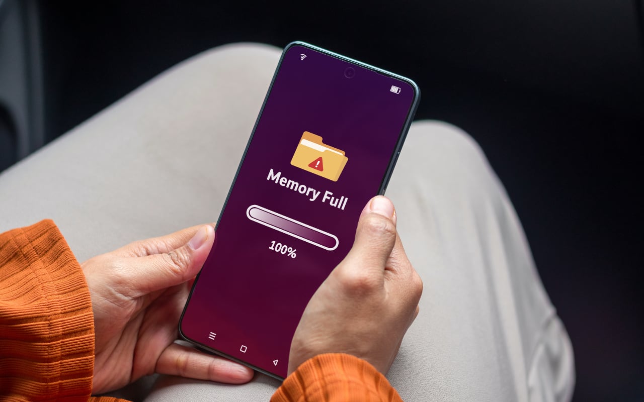 Hands hold an iPhone to illustrate Shared Albums at Work: What Changed and Why Your iCloud Storage May Fill Up | AustinMacWorks.com
